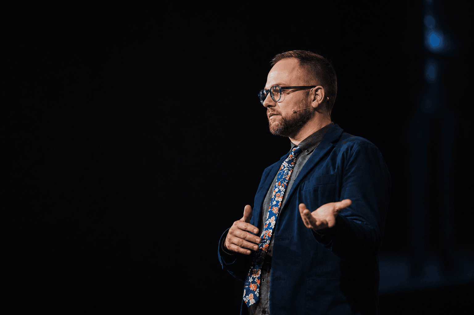 Thom Van Dycke speaking on stage